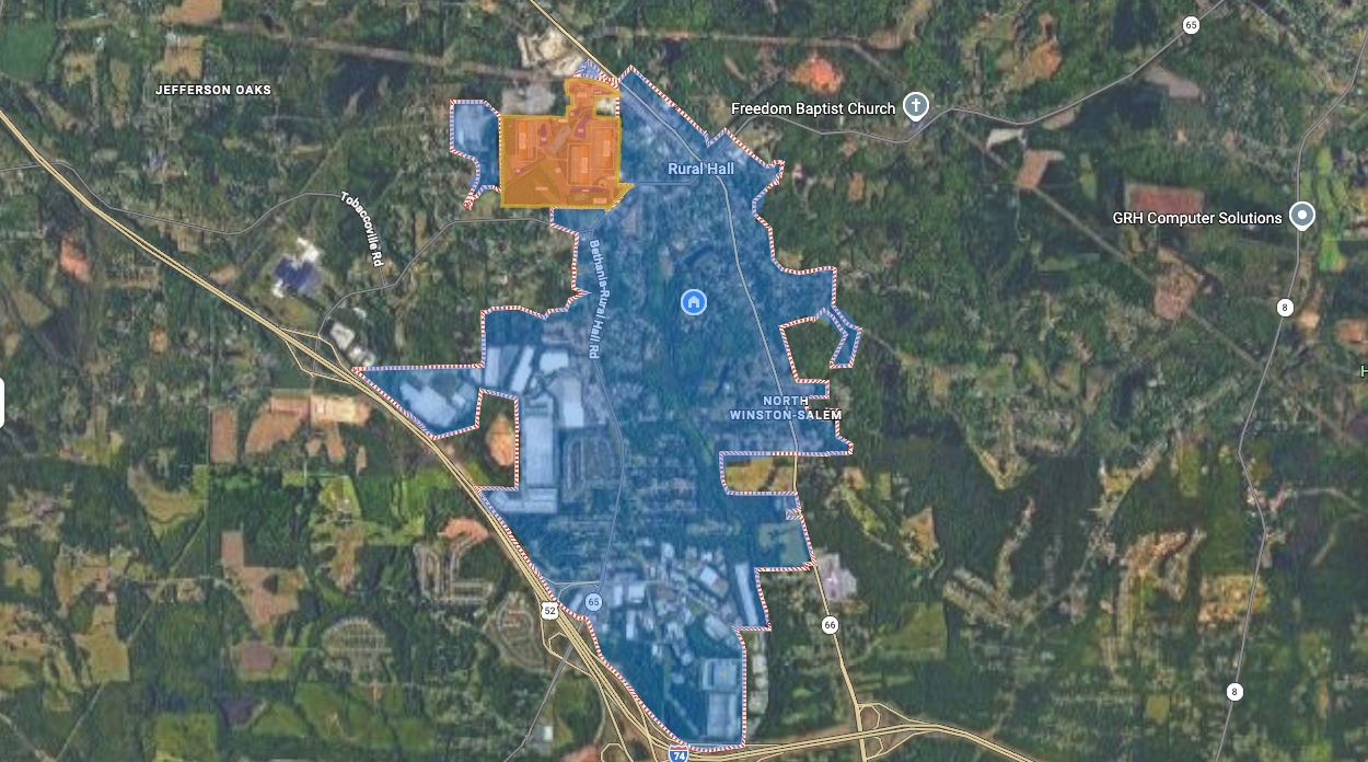 Area map: Rural Hall town shown in blue and the proposed three-building project site in orange, May 15, 2026 revision.